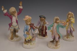 A collection of Meissen style continental porcelain monkey band figures