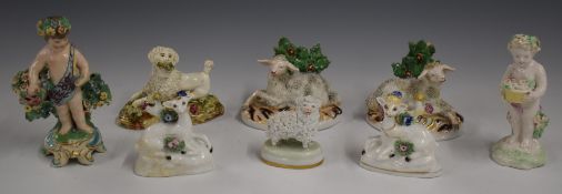 A collection of 19thC Derby and other figures including children with flowers, sheep etc, tallest