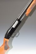 Mossberg 12 bore 3-shot pump-action shotgun with chequered semi-pistol grip and forend, adjustable