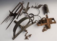 Six various vintage animal traps including a mole trap and one stamped 'Gallie Trap 602'.