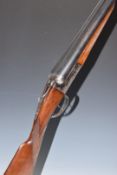 LIG 12 bore side by side shotgun with engraved locks, underside and fences, chequered grip and