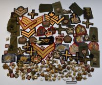 Collection of British Army cloth and metal rank and proficiency badges including Artillery etc