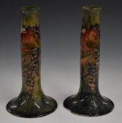 Moorcroft for Liberty & Co pair of candlesticks decorated in the Pomegranate pattern with open