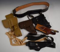 Five leather holsters including two Soviet examples, one with a belt, a French example etc