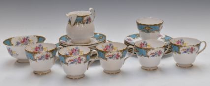 Twenty one pieces of Shelley tea ware decorated in the Blue Empress pattern, includes six trios.