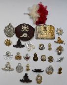 Small collection of British Army cap badges including Royal Artillery, Argyll & Sutherland