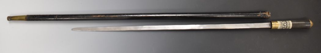 Swordstick with inlaid bone handle, brass lion head pommel and 58cm blade. PLEASE NOTE ALL BLADED