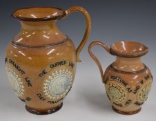 Two Royal Doulton Mottoware jugs with portrait cartouche, tallest 20cm