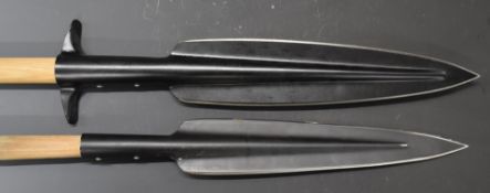 Two modern spears, longest head 35cm, overall length 200cm. PLEASE NOTE ALL BLADED ITEMS ARE SUBJECT