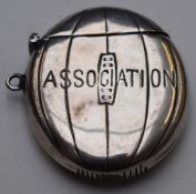 White metal vesta in the form of a football or rugby ball with impressed 'Association' to front,