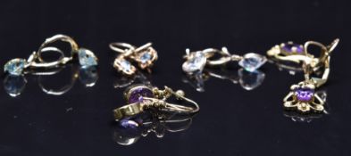 Five pairs of 9ct gold earrings set with amethyst, topaz and cubic zirconia, 10.6g