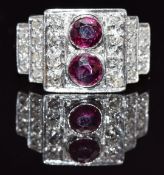 Art Deco platinum ring set with two round cut rubies and diamonds in a tiered setting, size N, 8.4g