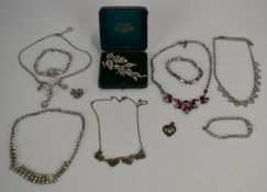 A collection of vintage diamanté jewellery including paste brooch in original box