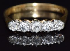 An 18ct gold ring set with five old cut diamonds, size Q, 3g
