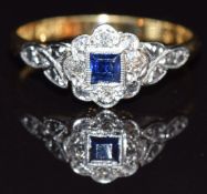 An 18ct gold ring set with a sapphire and diamonds in a platinum setting, size M, 2.3g