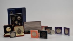 A collection of various cupronickel cased crown sized coins, a first decimal set and a Bahrain set