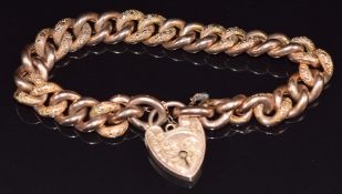 A 9ct rose gold curb link bracelet with textured links with heart padlock/ clasp, 19.5g