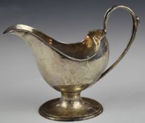Art Nouveau Walker & Hall hallmarked silver sauce boat of flowing naturalistic design, Chester 1906,