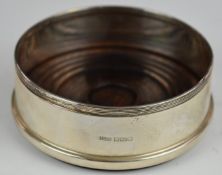 Hallmarked silver mounted wine bottle coaster, Birmingham 1995, maker Reign Beau Ltd, diameter 11cm