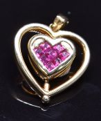 An 18k gold swivelling heart shaped pendant set with princess cut diamonds, verso square cut rubies,