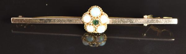 A 9ct gold brooch set with a cluster of opals, 3g