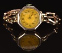Unnamed 9ct gold ladies wristwatch with blued hands, black Arabic numerals, gold dial, octagonal