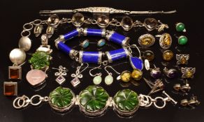 Two silver bracelets, one set with quartz the other faux lapis lazuli, a matching silver bracelet