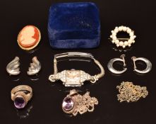 A collection of jewellery including silver earrings, silver ring and pendant set with an amethyst,