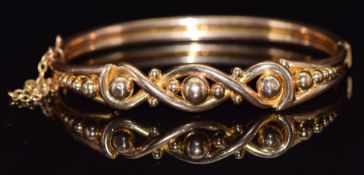 Victorian/ Edwardian yellow metal bangle with sphere decoration, 14.4g