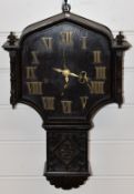 Oak cased c1920 carved drop dial wall clock with Roman brass numerals and three train movement