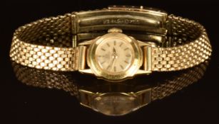 Omega 18ct gold ladies wristwatch with gold hands and baton hour markers, silver dial and signed