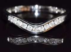 A 9ct white gold half eternity ring set with diamonds, total diamond weight approximately 0.2ct,