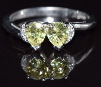 A 9k white gold ring set with chrysoberyl and diamonds, size N, 3g