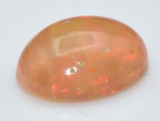 A loose oval opal cabochon, measuring approximately 0.82cts