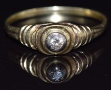 A yellow metal ring set with a diamond in a tiered setting, size S, 2.2g