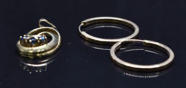 A 9ct gold pendant set with three sapphires and a pair of 9ct gold earrings, 3g