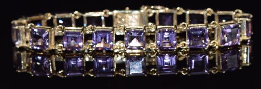 A 9ct gold bracelet set with square cut amethysts, 27.4g