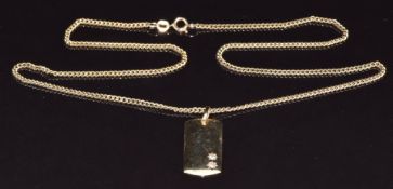 A 9ct gold pendant set with two diamonds in star settings on a 9ct gold chain, 11.8g
