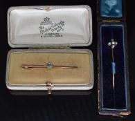 A 9ct gold brooch set with a zircon and a Victorian stick pin set with a pearl and turquoise, 3g