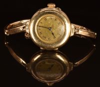 Unnamed 14ct gold ladies wristwatch with blued hands, black Arabic numerals, gold dial and