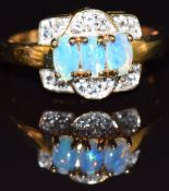 A 9k gold ring set with opal and topaz, size N, 3.3g