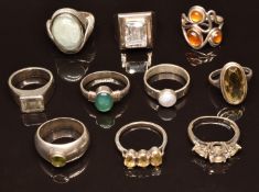 Ten silver rings set with quartz, peridot, etc