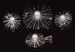 A suite of bespoke 14k white gold jewellery comprising brooch, pendant and earrings, each piece