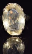 A 9ct gold ring set with an oval cut citrine, size M, 6.2g