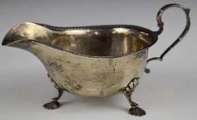 George VI Mappin & Webb hallmarked silver sauce boat with gadrooned edge, raised on three feet,