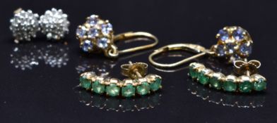 Three pairs of 9ct gold earrings set with emeralds, tanzanites and diamonds, 6g