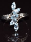 A 9k white gold ring set with marquise cut aquamarines and diamonds, size N, 2.6g