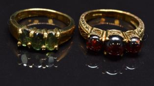 Two 9ct gold rings, one set with garnet cabochons the other sapphires, size N, 7.8g