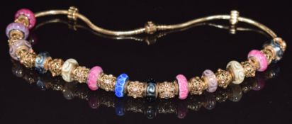 A 14k gold Pandora necklace, the snake link chain suspending thirteen 14ct gold and Murano glass