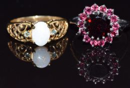 A 9ct white gold ring set with garnets and a 9ct gold ring set with an opal and alexandrite, size N,